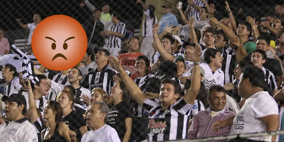 Hinchada de Libertad enojada